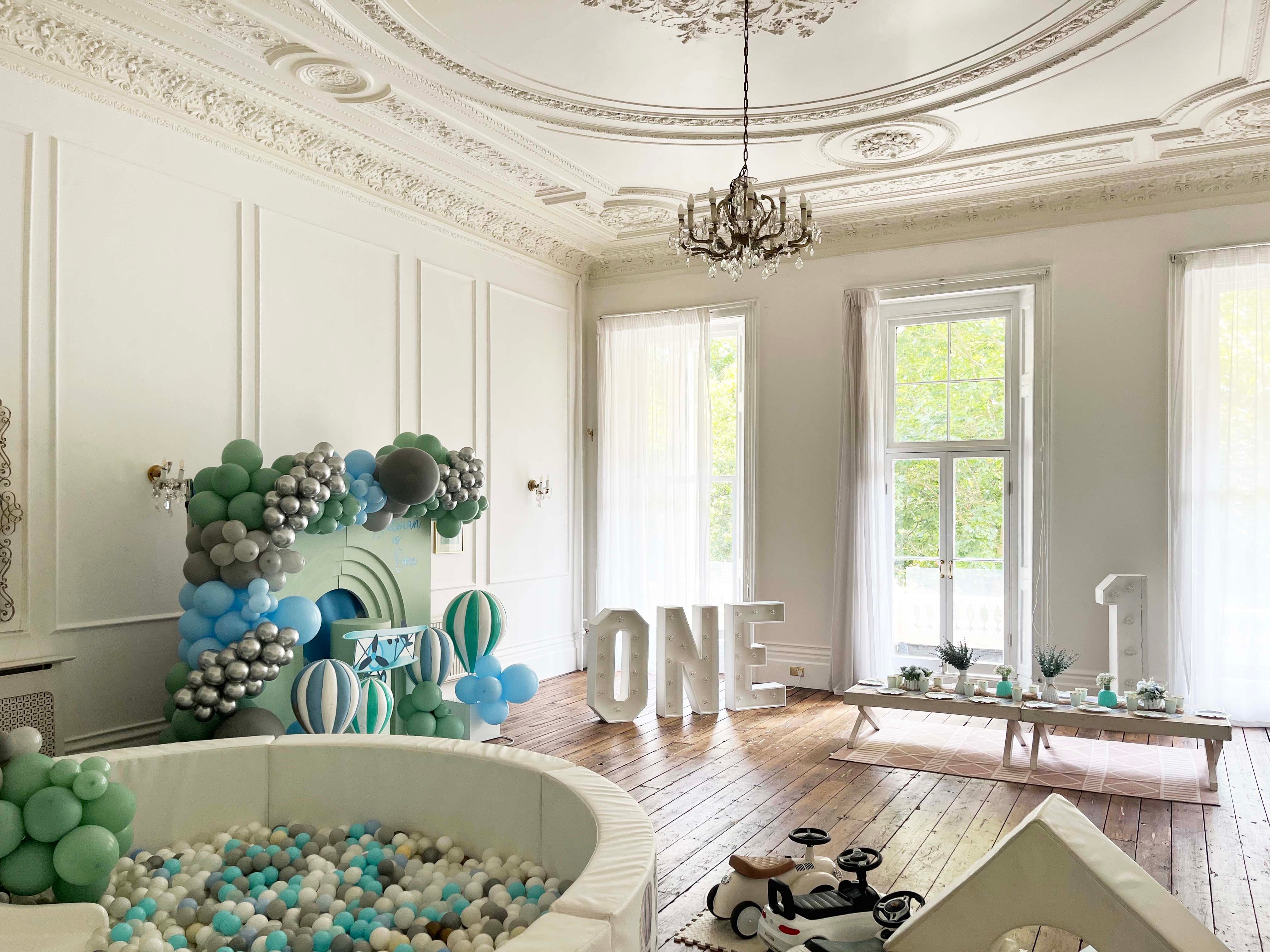 Viceroy & Regency Suites, elegant birthday event space with balloon arch and ball pit.