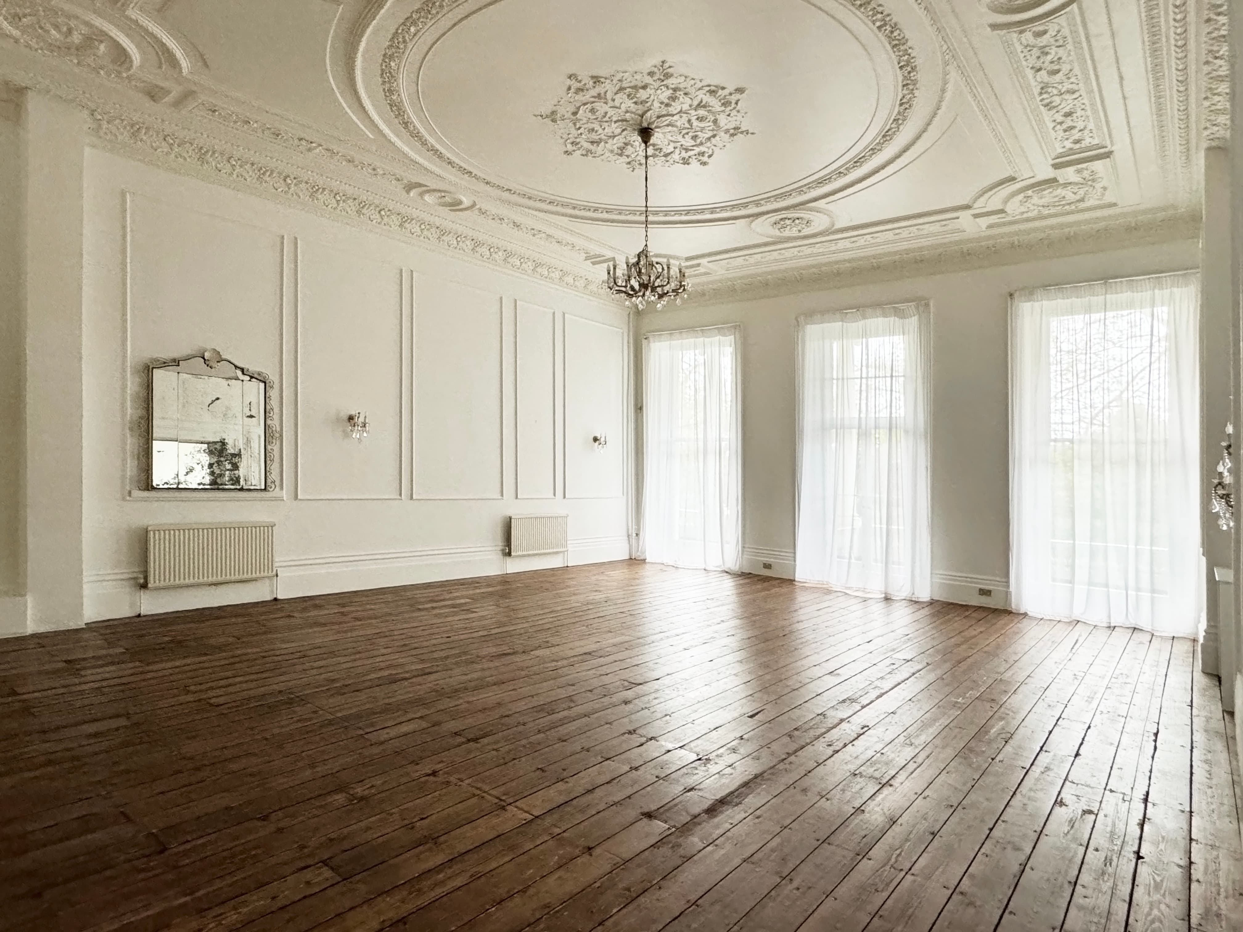 Elegant event space with high ceilings, ideal for weddings and corporate functions.