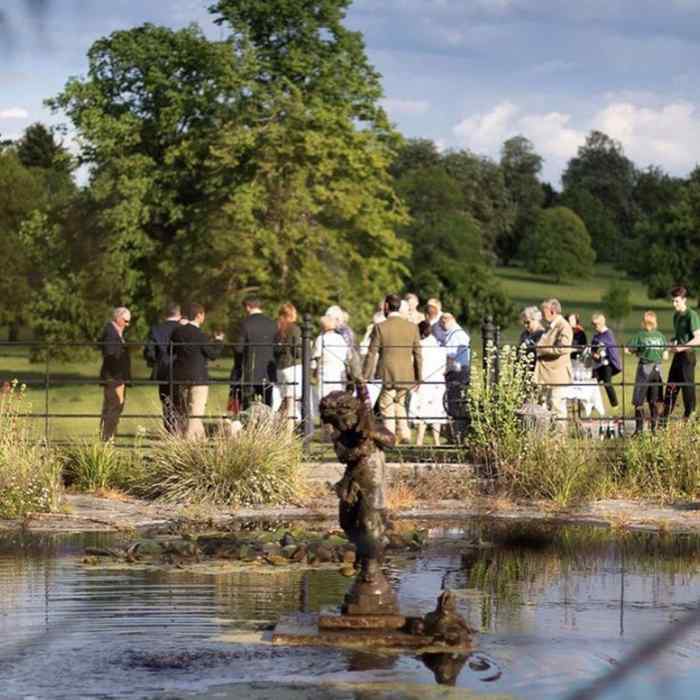 Arboretum at Courteenhall Estate: elegant outdoor networking event in a scenic landscape.