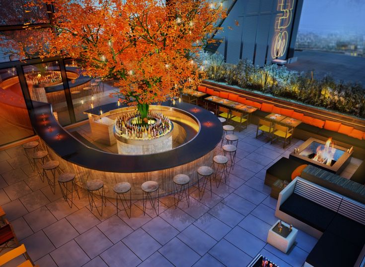 Stylish rooftop bar at SUSHI SAMBA with autumn tree centerpiece, perfect for cocktail receptions.