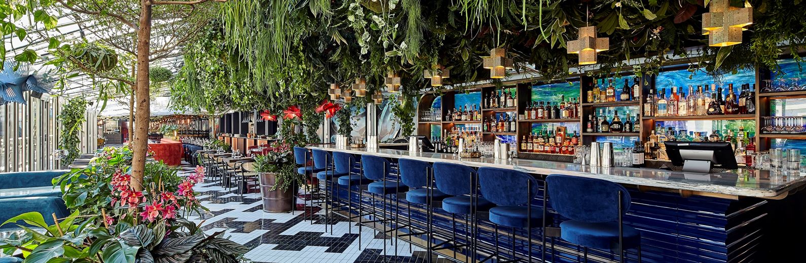 Vibrant SUSHI SAMBA bar with lush greenery, ideal for networking events and cocktail receptions.