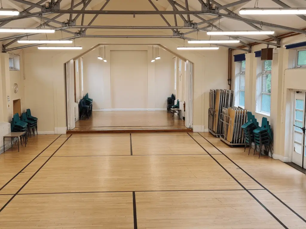 Large Hall in Barnsbury Community Centre with polished wooden floor, ideal for events and workshops.