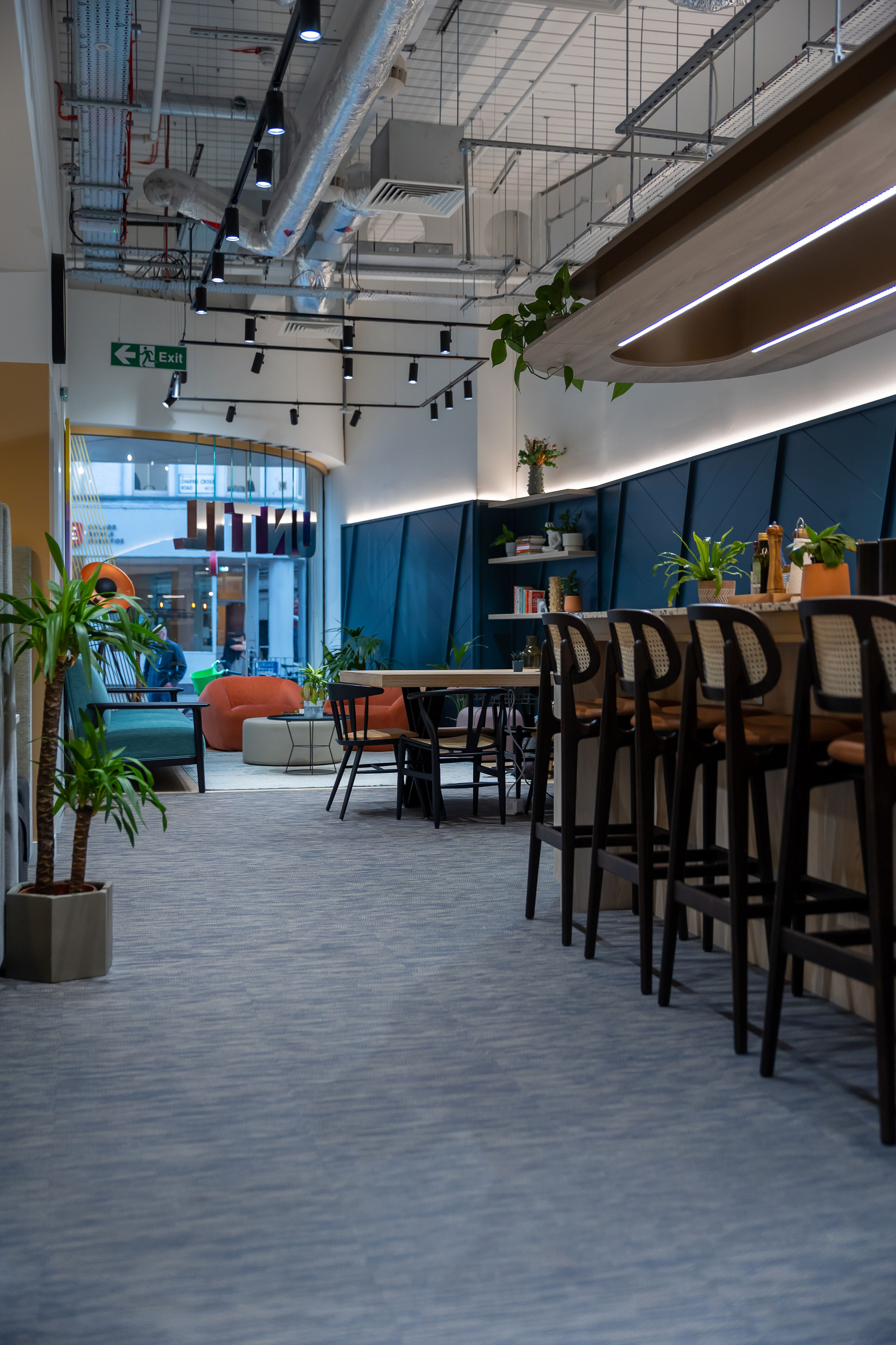 Modern event space at UNTIL Soho with greenery, ideal for workshops and networking.