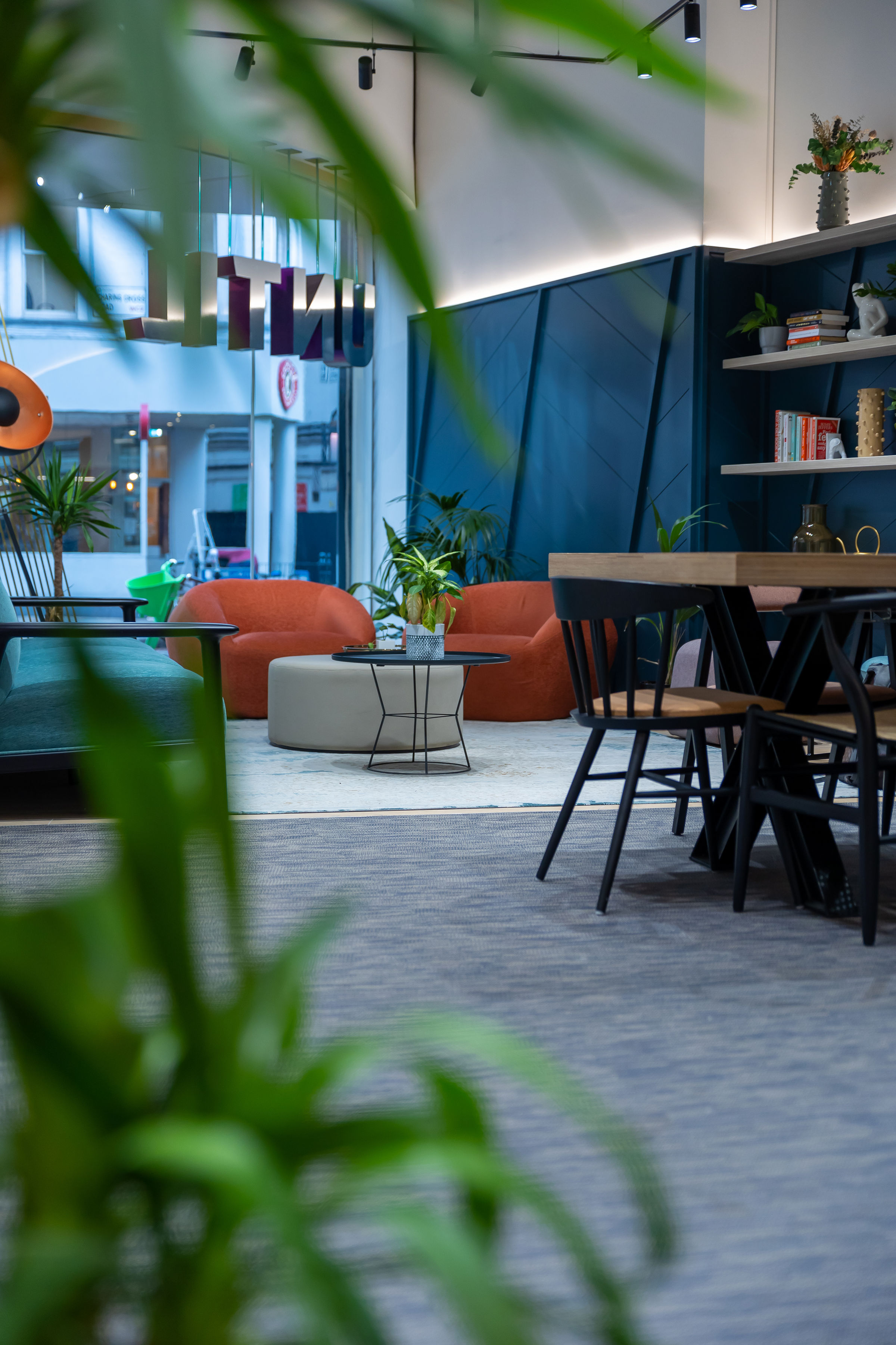 Modern meeting space in UNTIL Soho with greenery for collaboration and creativity.
