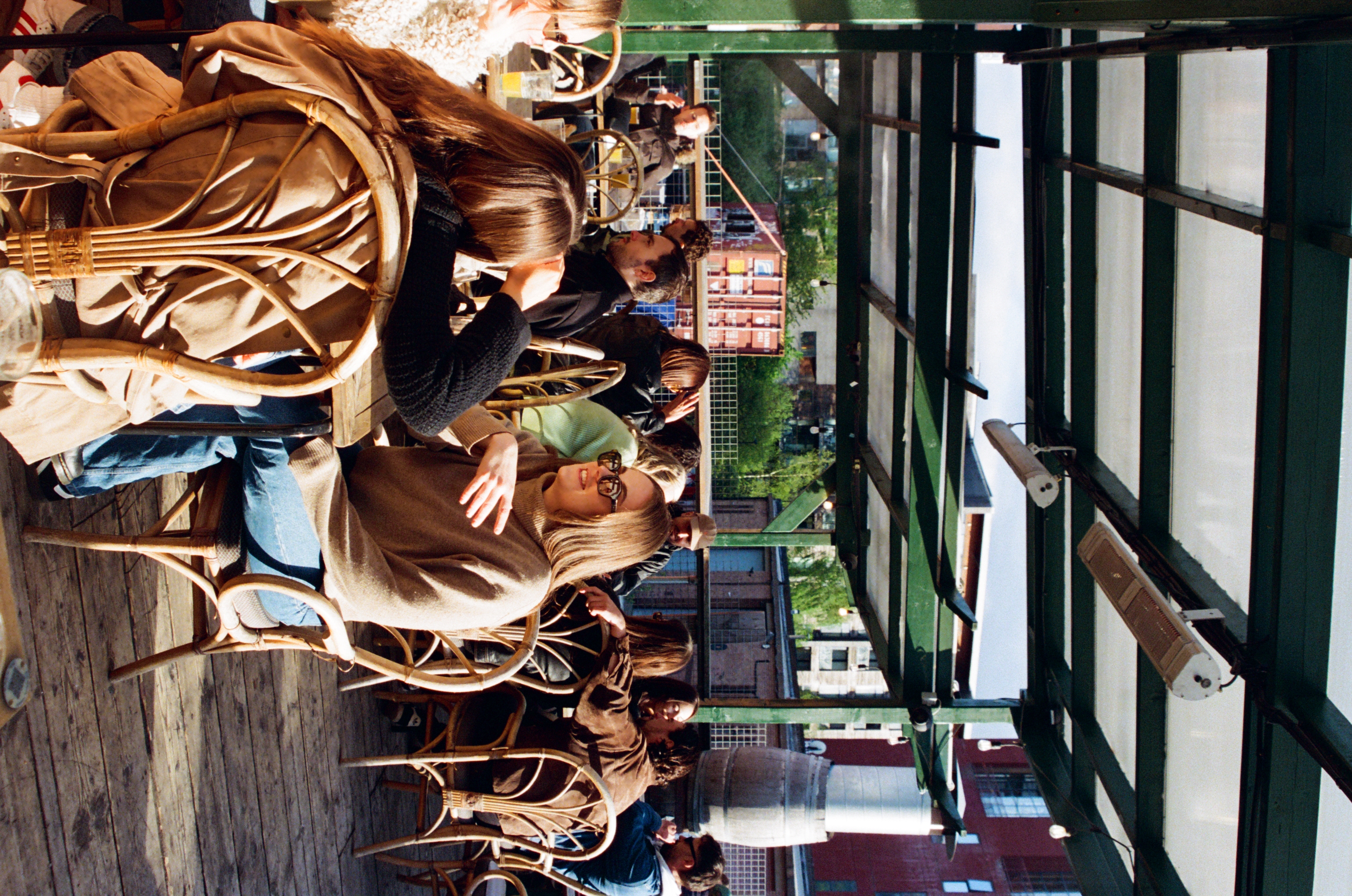 Vibrant outdoor networking event at Hackney Wick with relaxed seating and natural light.