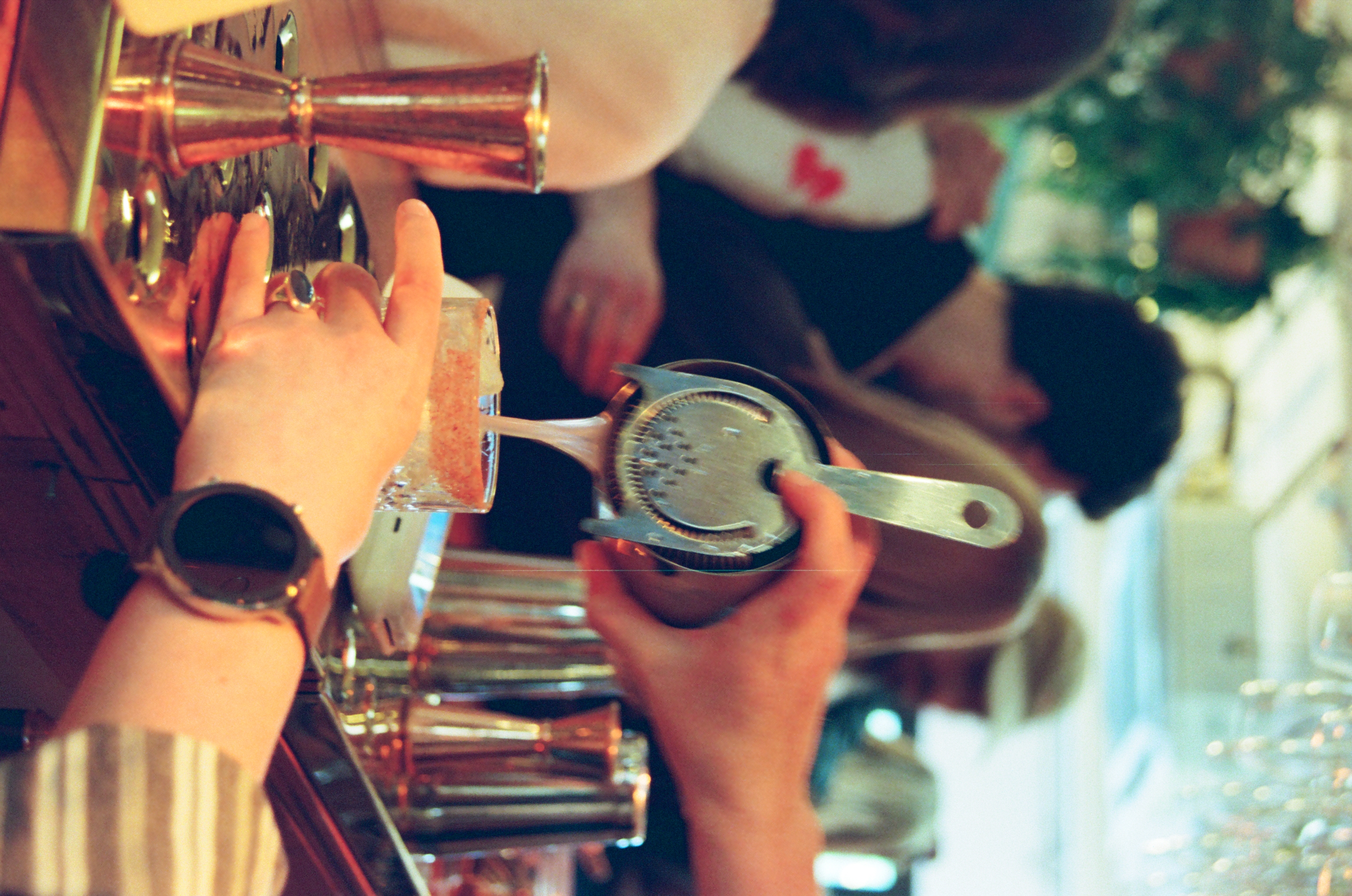 Bartender straining cocktail at Hackney Wick Hangout, perfect for social events and networking.