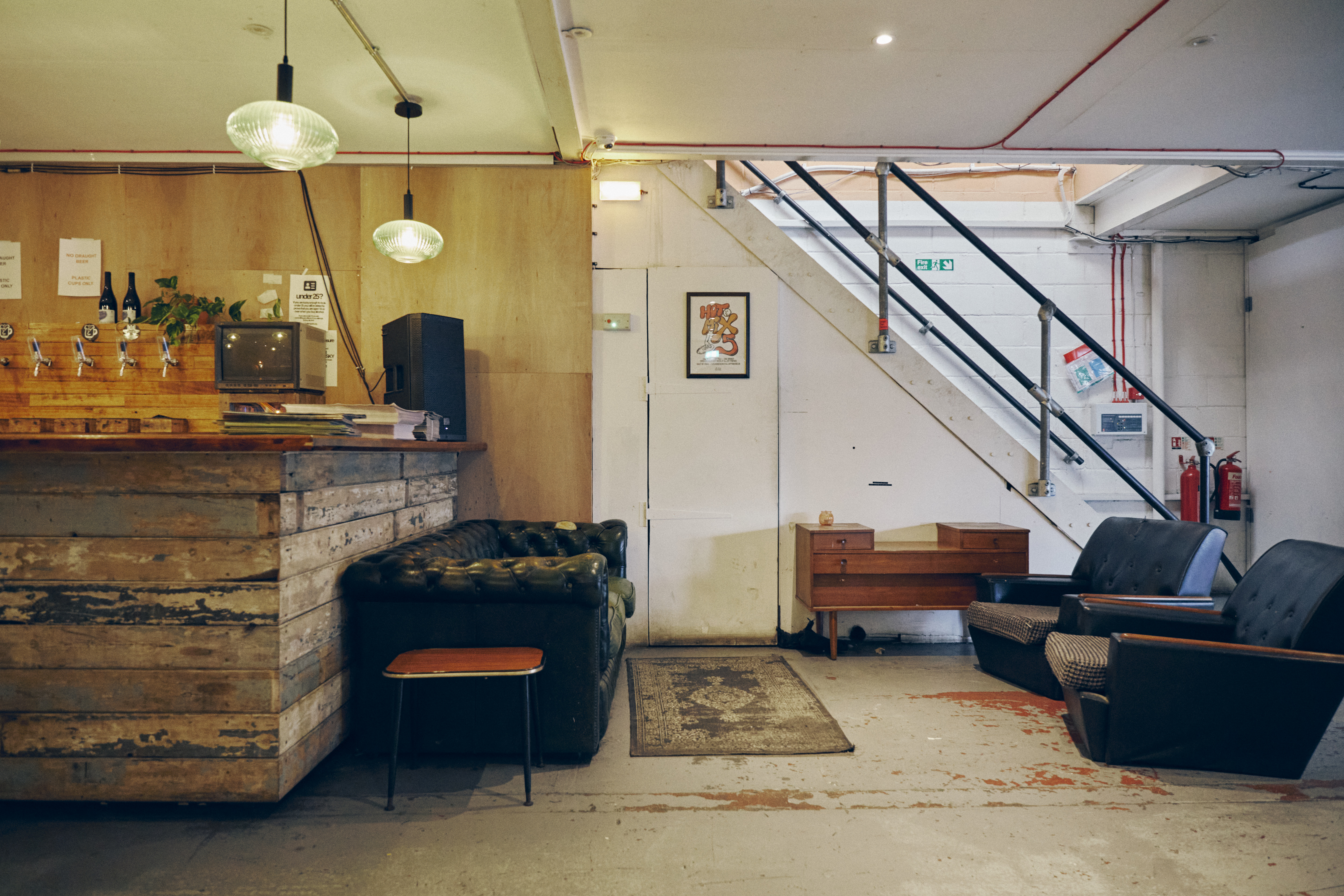 Cozy Hackney Wick Hangout with rustic bar, perfect for casual gatherings and networking.