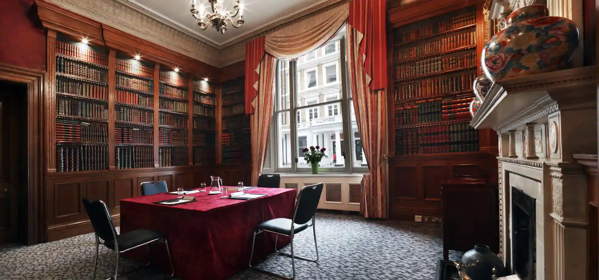 Sophisticated meeting room with wooden paneling at Gem Strathmore Hotel for events.
