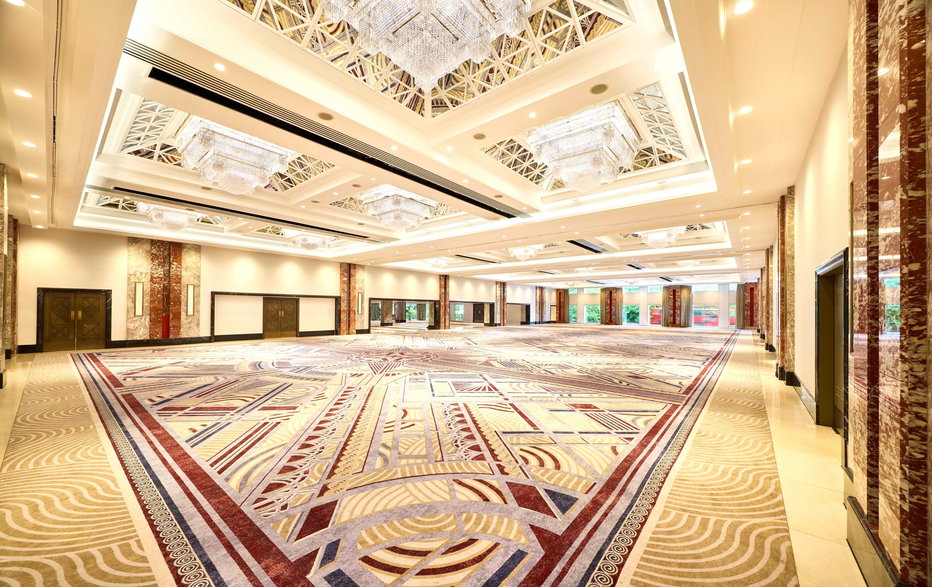Pillarless Royal Lancaster London ballroom with statement carpet for corporate galas and events.