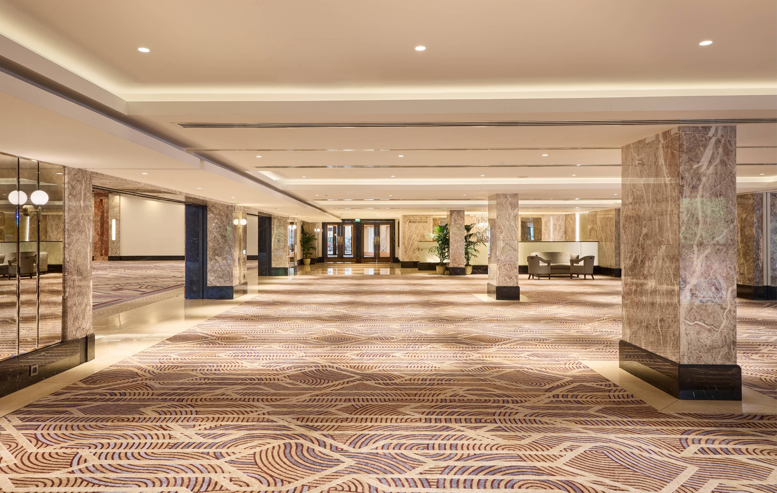Royal Lancaster London event space with elegant pillars for corporate receptions and conferences.