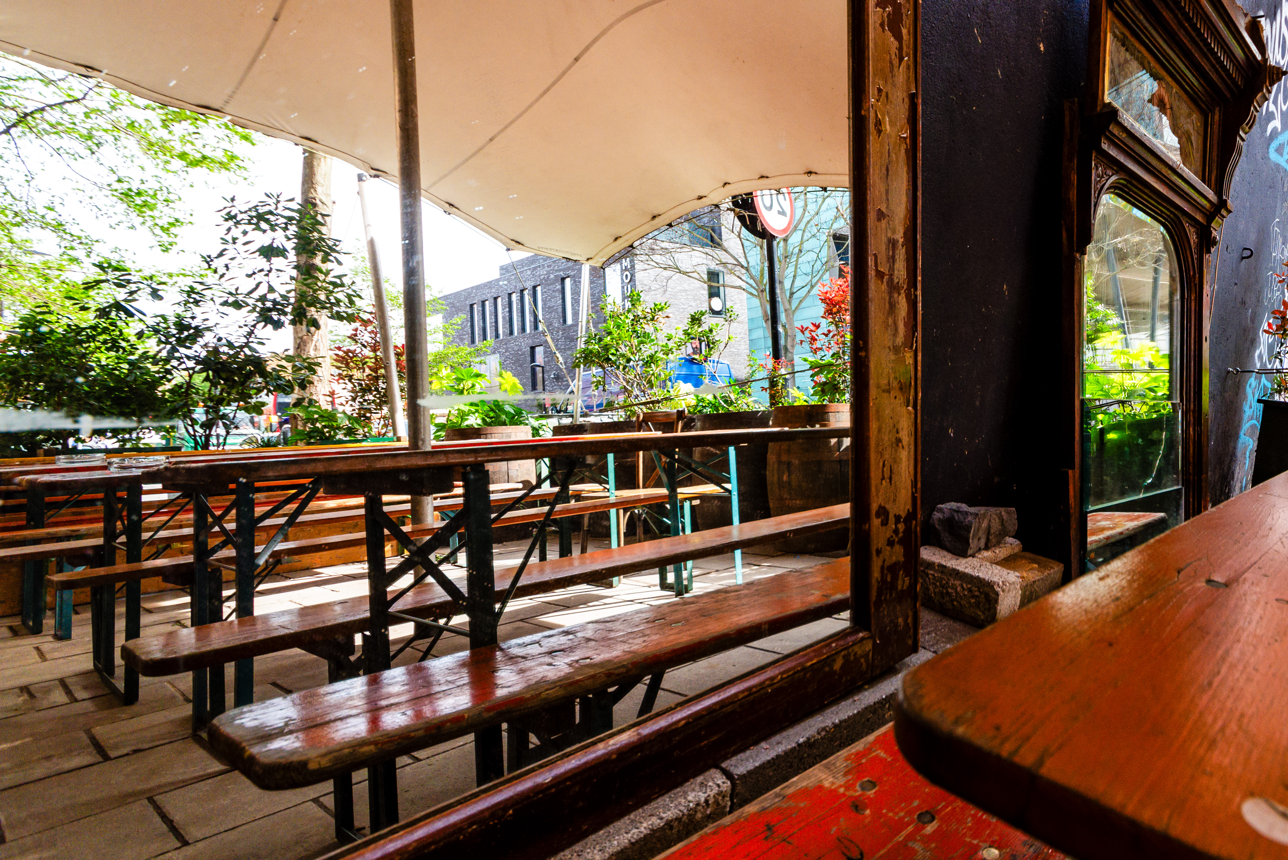 Outdoor event space at The Greyhound Peckham with rustic seating for summer gatherings.