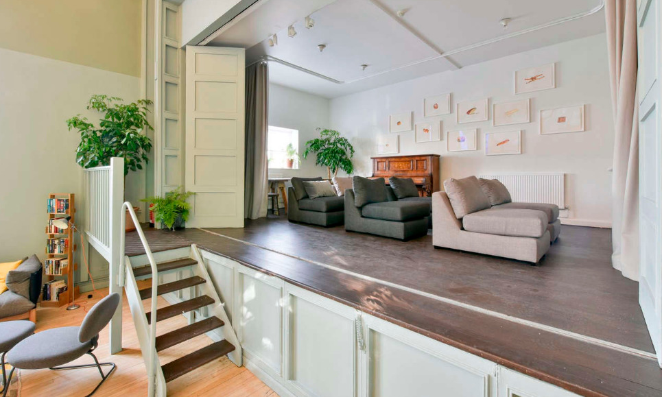 Versatile event space with seating at Refettorio Felix, ideal for gatherings and workshops.