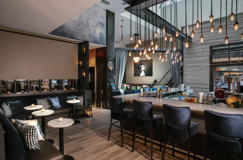 Empire Bar and Terraces at Archer Hotel, modern event space for gatherings and networking.