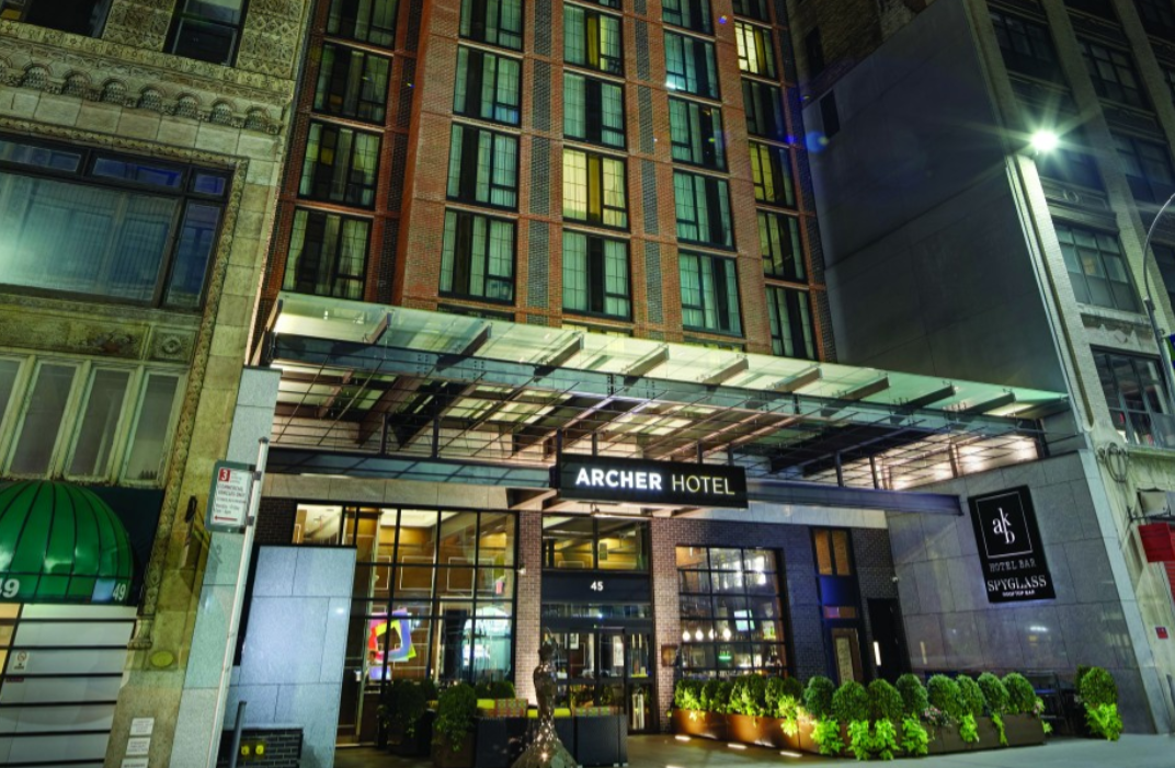 Empire Bar and Terraces at Archer Hotel, modern entrance for corporate events and gatherings.