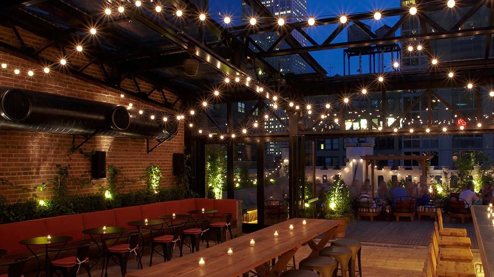 Rooftop venue with string lights, perfect for events and gatherings at The Refinery.
