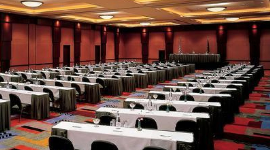 Conference room at Loews Philadelphia Hotel with tables and chairs for meetings.