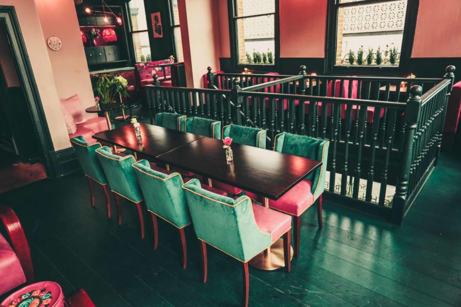 Karaoke room at Star of Bethnal Green with elegant table, ideal for networking events.