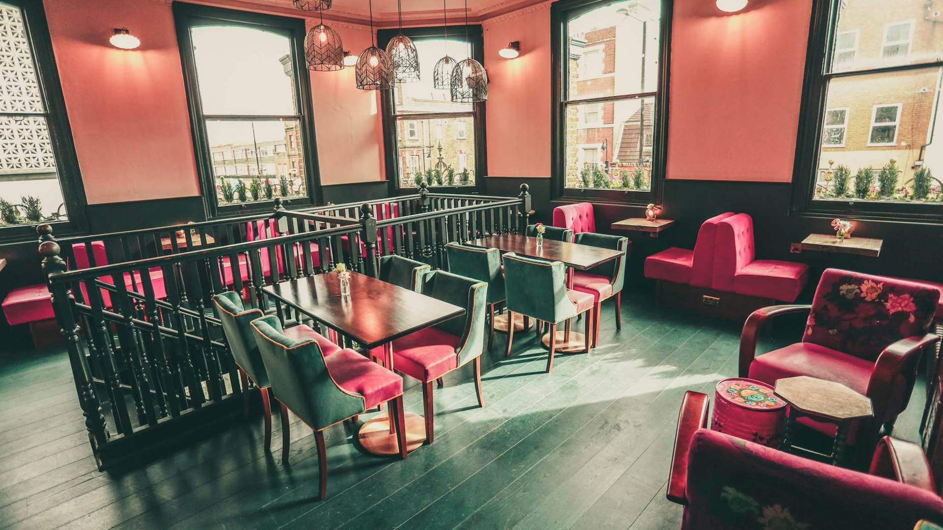 Stylish Downstairs Bar event space with warm lighting for networking and gatherings.