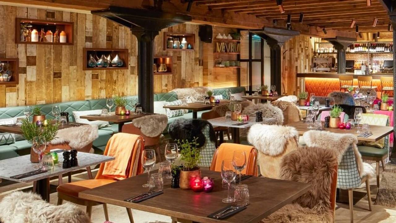 Cozy dining area with warm wood accents, perfect for intimate gatherings and events.