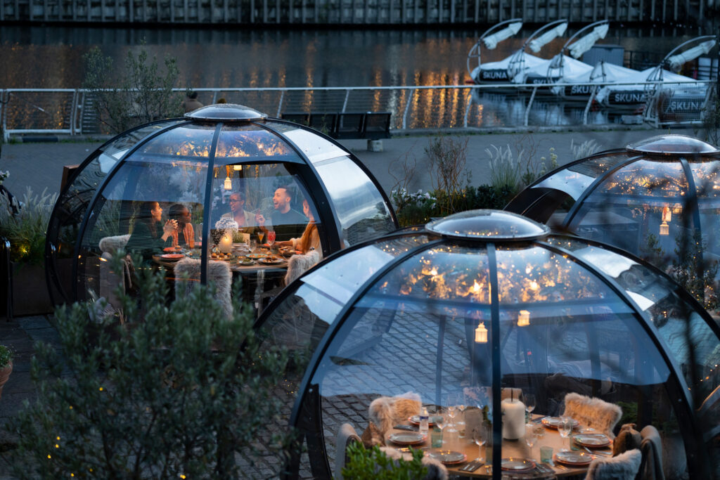 Outdoor geodesic domes at The Sipping Room for intimate dining and corporate events.
