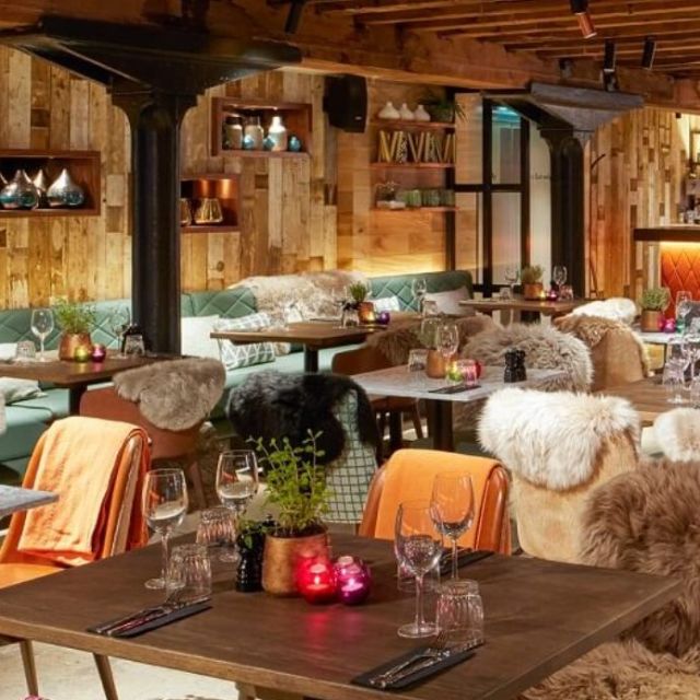 Cozy private booths in The Sipping Room, perfect for intimate gatherings and events.