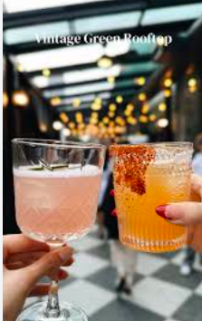 Vibrant cocktails in a vintage green living room, perfect for networking events.