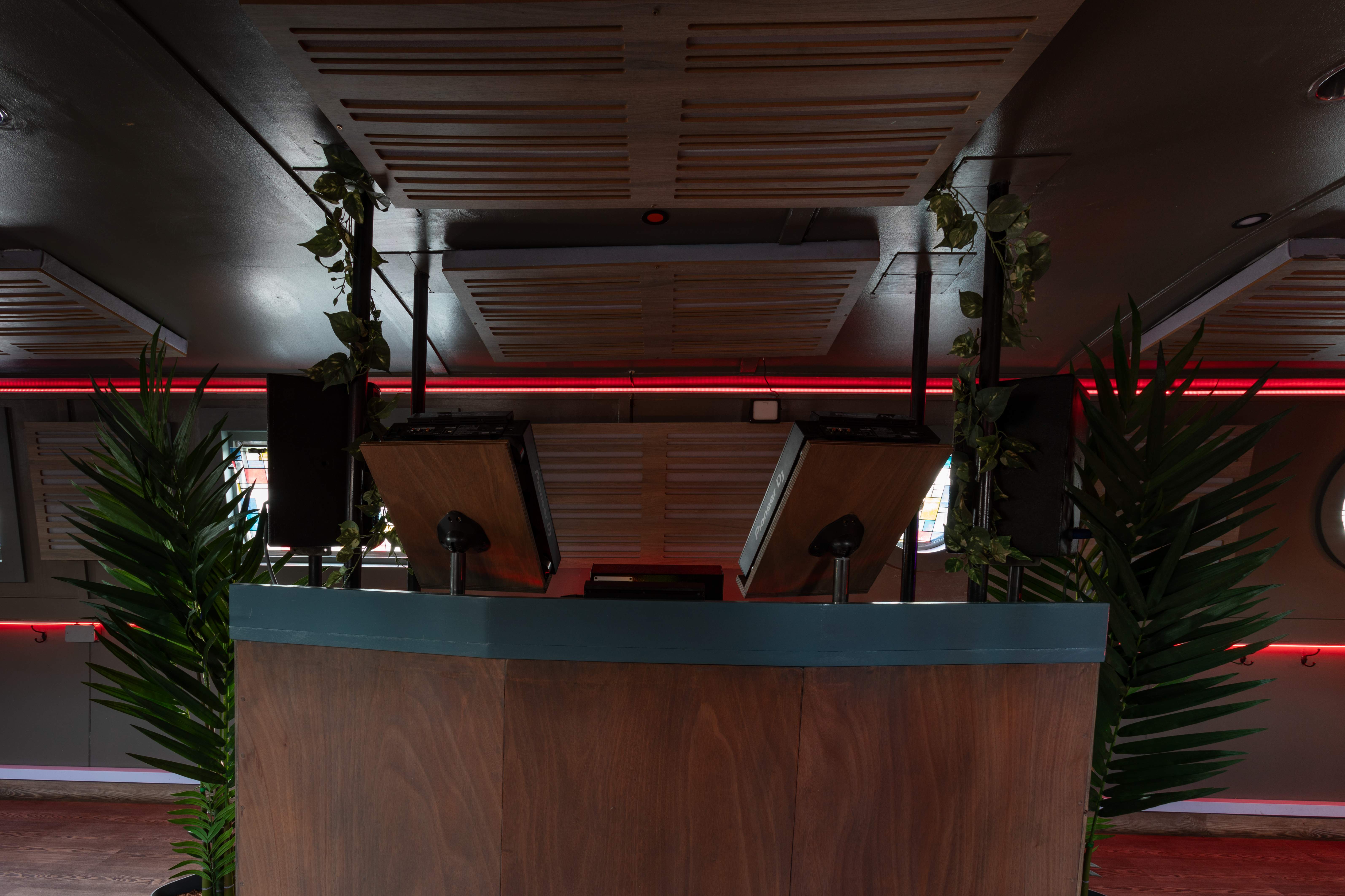 Floating mobile event space with sleek bar, perfect for cocktail receptions and gatherings.