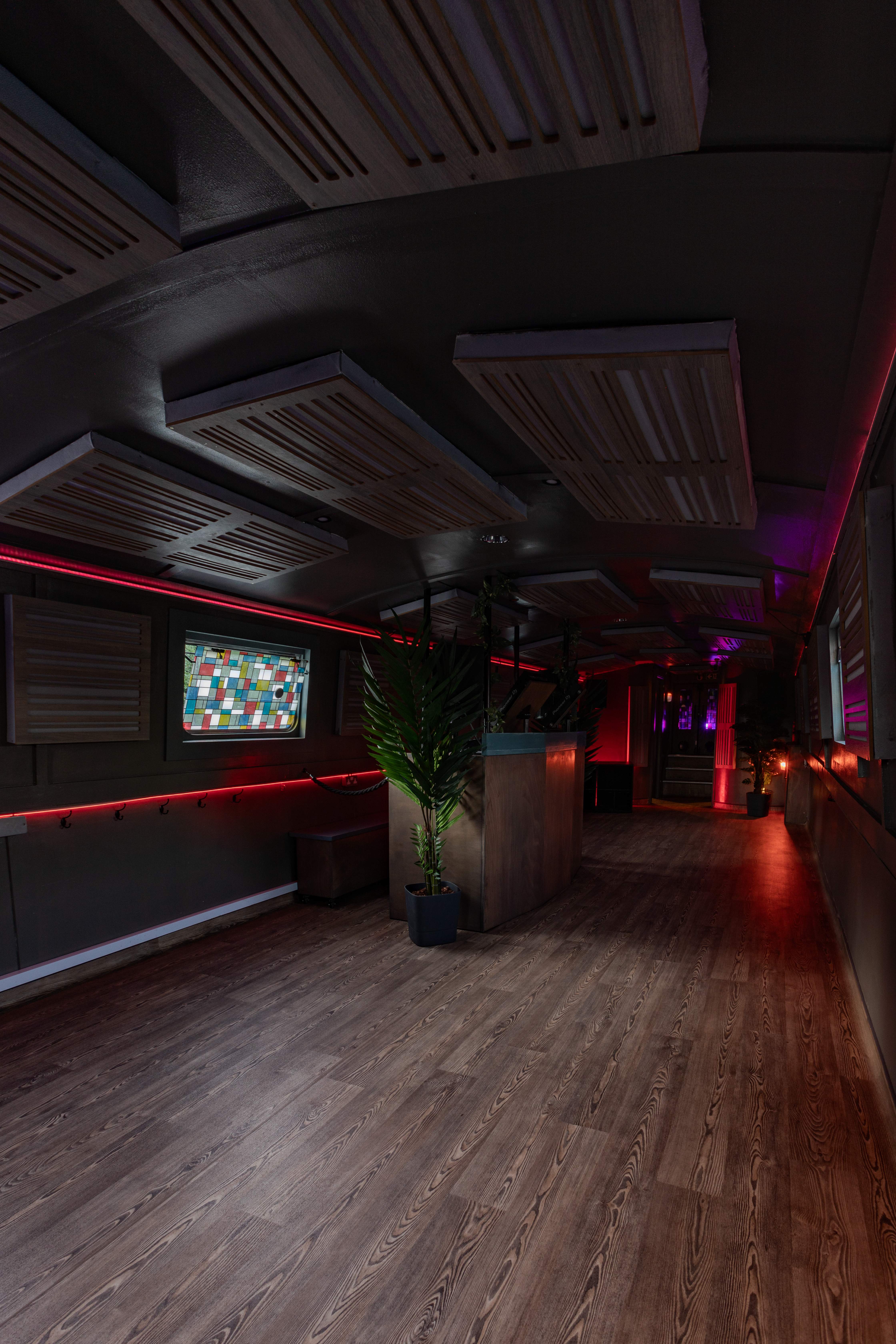 Floating mobile event space with ambient lighting, perfect for networking and gatherings.