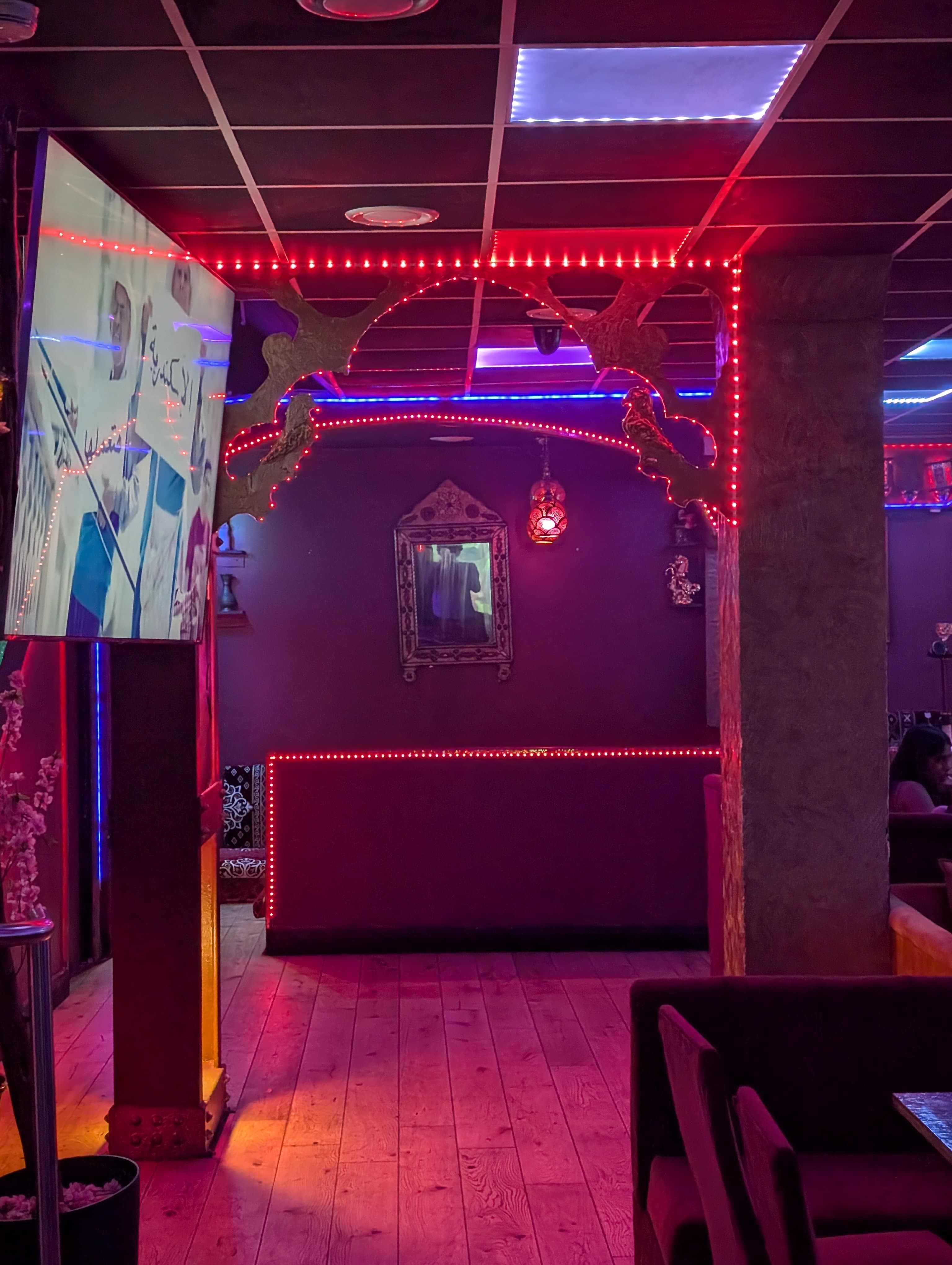 Vibrant Dream Lounge private section with LED lights for themed events and gatherings.