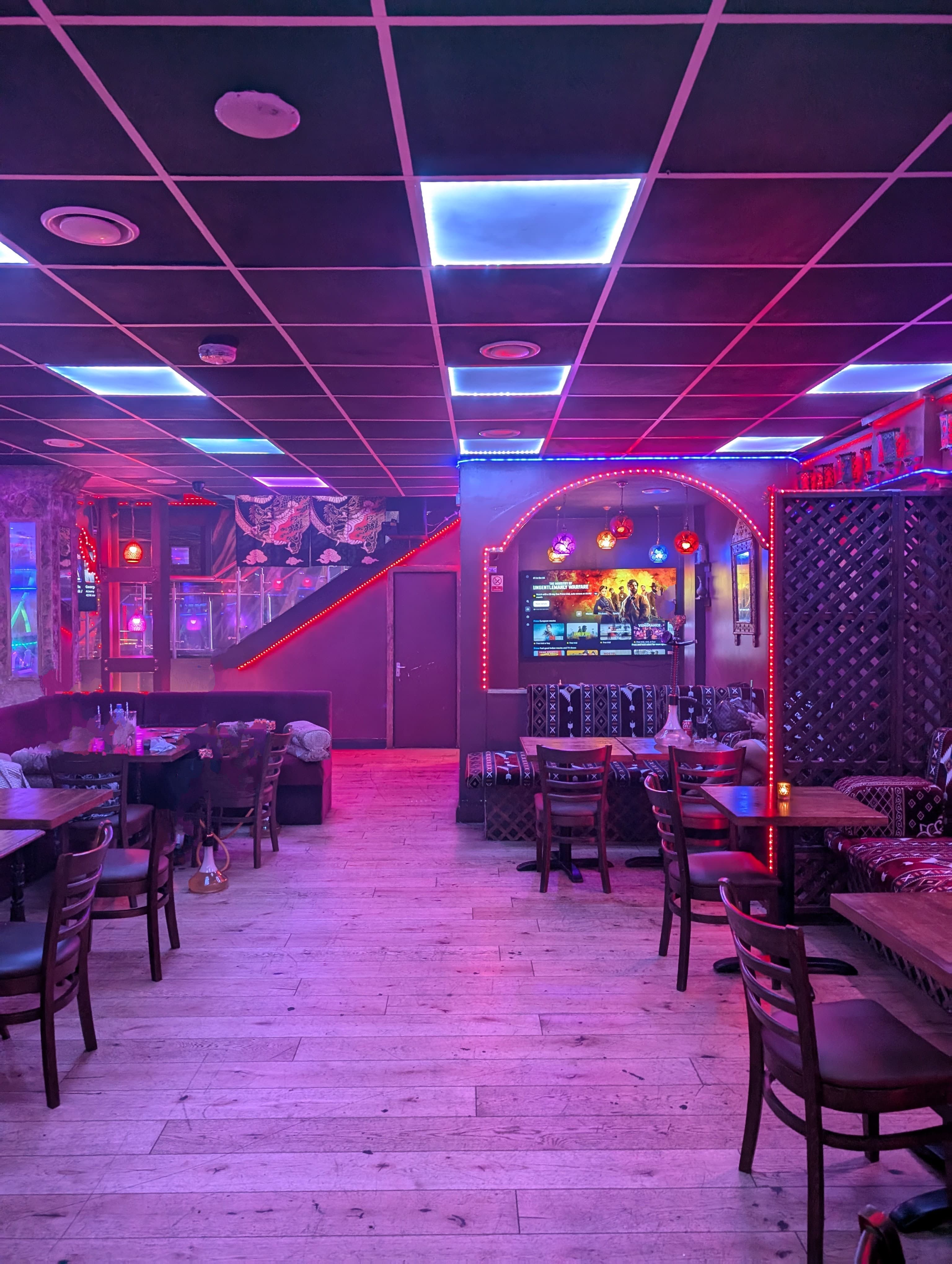 Vibrant Dream Lounge with neon lighting, perfect for themed parties and gatherings.