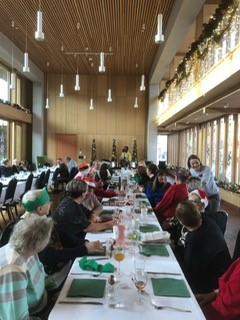 Festive gathering in The Garden Room, Appleby Blue Almshouse, ideal for holiday events.