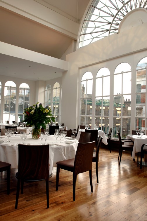 Elegant Floral Hall dining setup with round tables for upscale events and meetings.