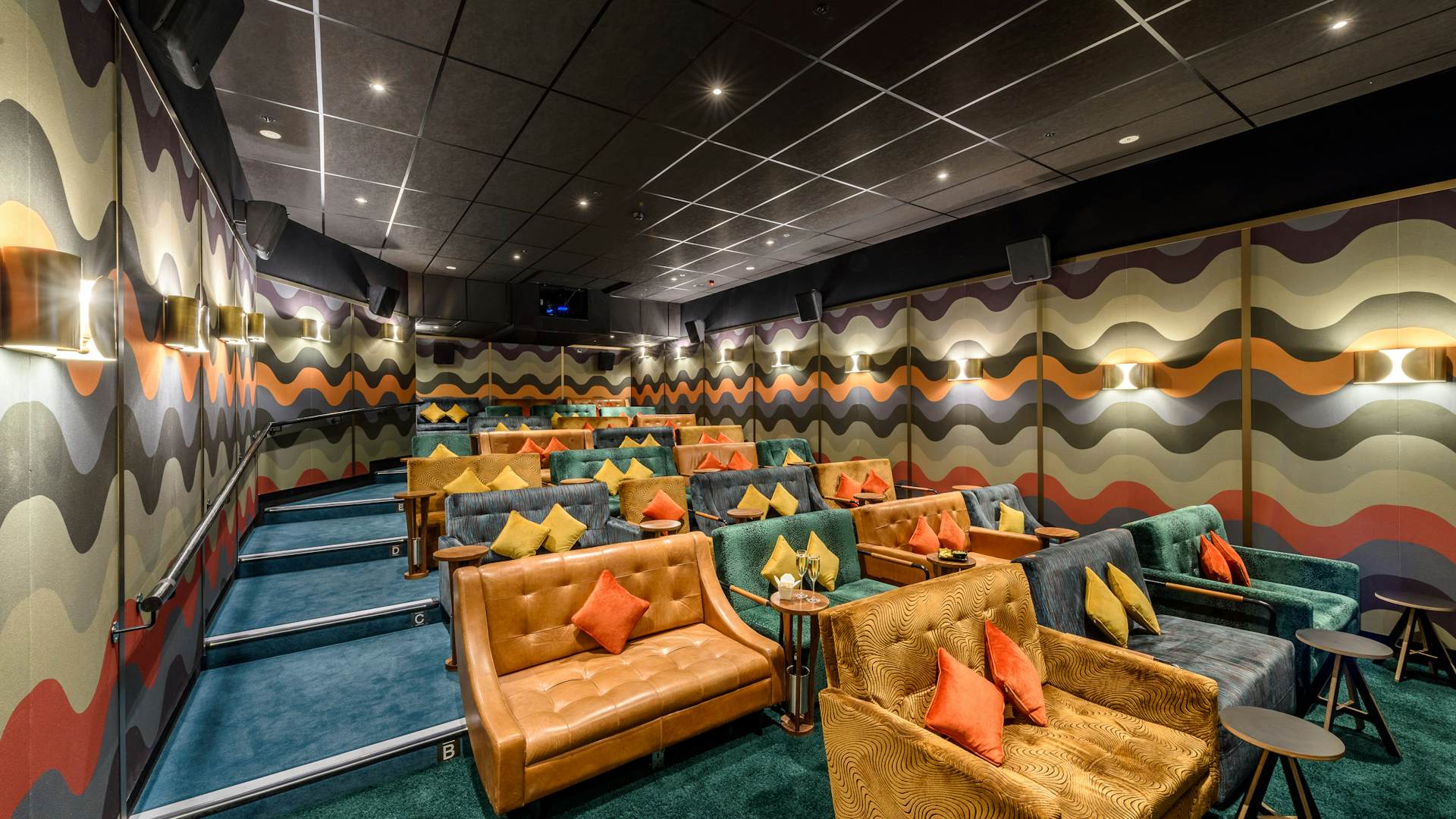 Stylish event space with tiered seating at Statement Bar, Everyman Canary Wharf.