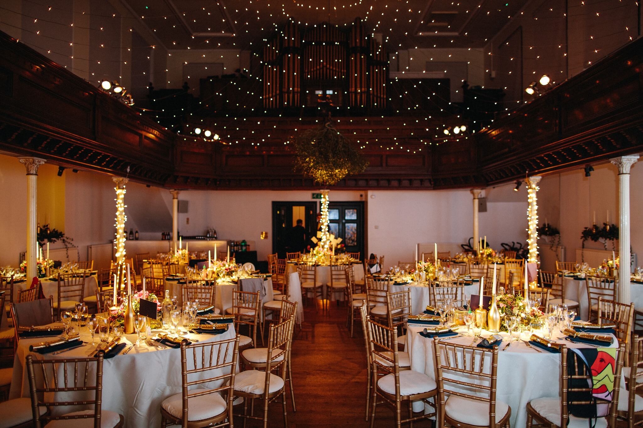 Elegant wedding venue with floral centerpieces and soft lighting for formal gatherings.