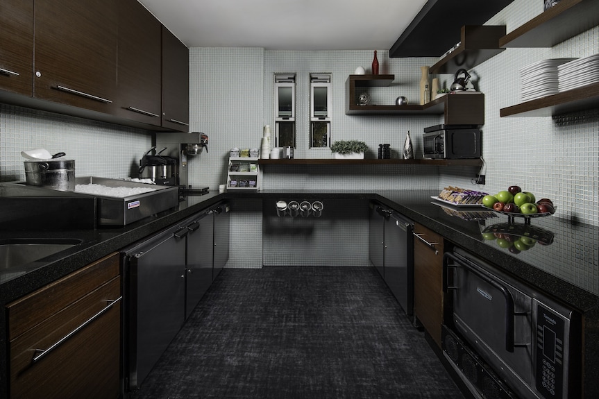 Modern kitchen in Hercor Hotel, ideal for events with sleek cabinetry and ample counter space.