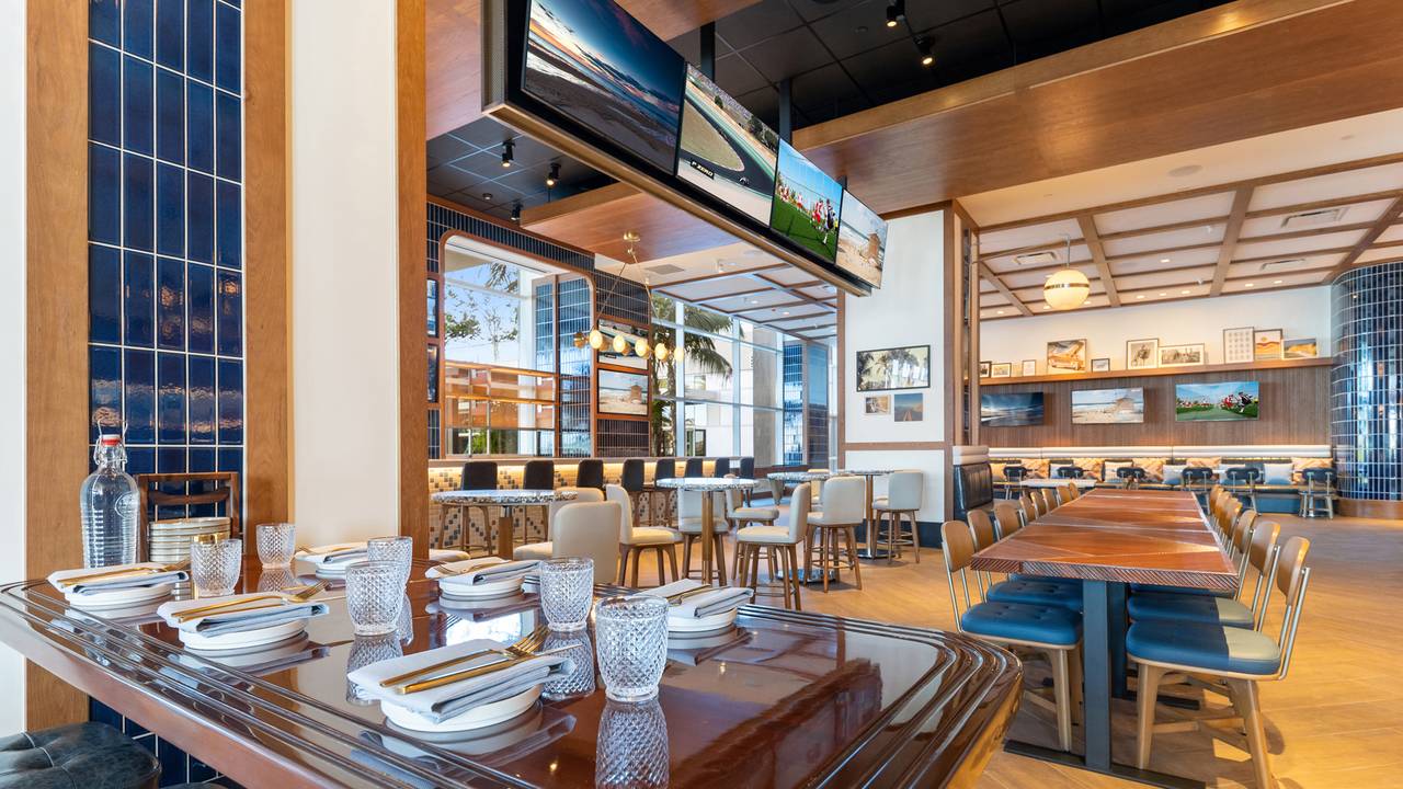 Modern dining space at Hudson & Nash, ideal for events with natural light and communal tables.