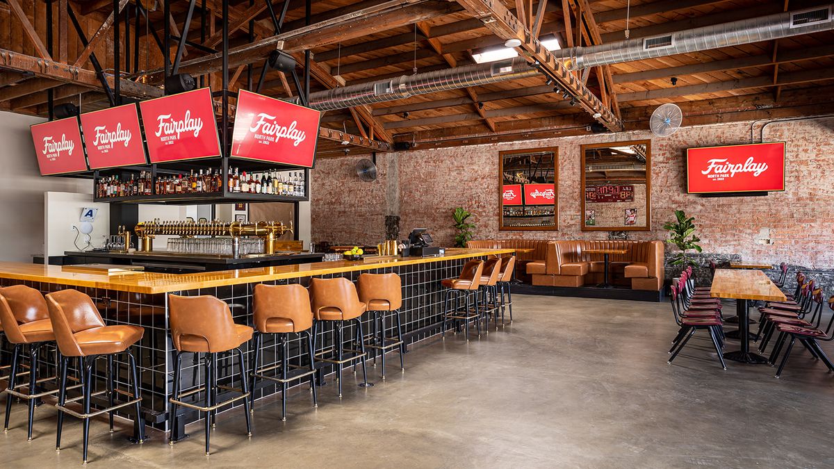 Stylish Brick by Brick lounge with modern bar, ideal for corporate events and gatherings.