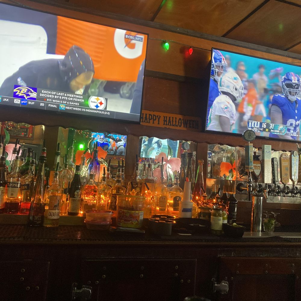 Enclosed Smoking Patio at Casbah with Halloween decor for lively sports watch parties.