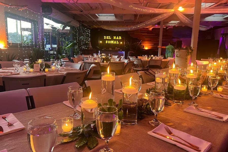 Elegant wedding venue with soft candlelight and sophisticated table settings in Del Mar.