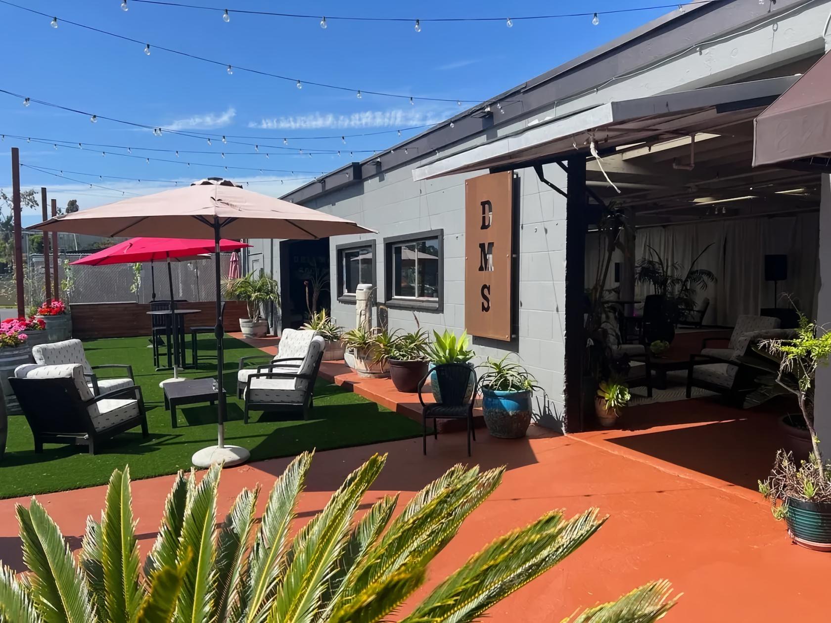 Outdoor event space in Del Mar with inviting seating and greenery for gatherings.