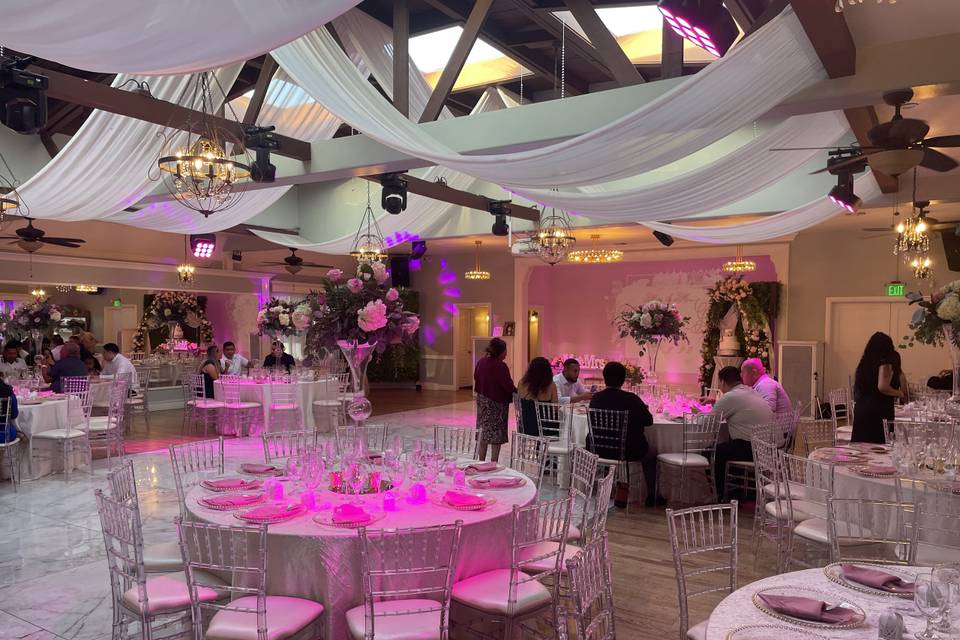 Atlantis Banquet Hall with pink lighting, perfect for weddings and formal events.
