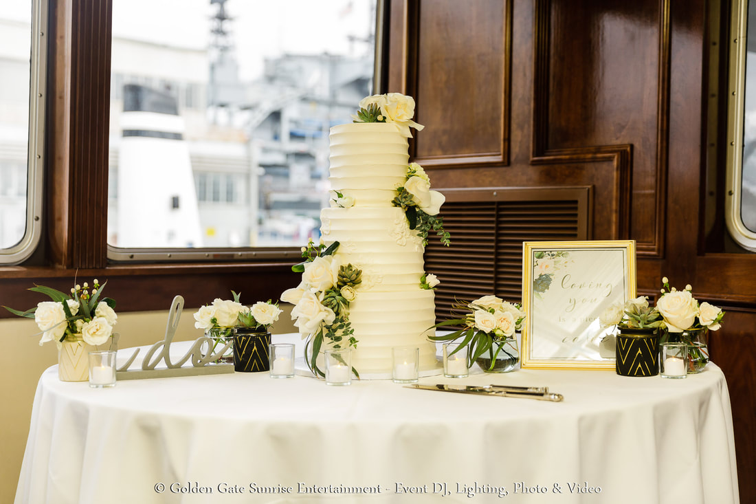 Flagship Cruises California Princess Yacht wedding cake display with floral decor.