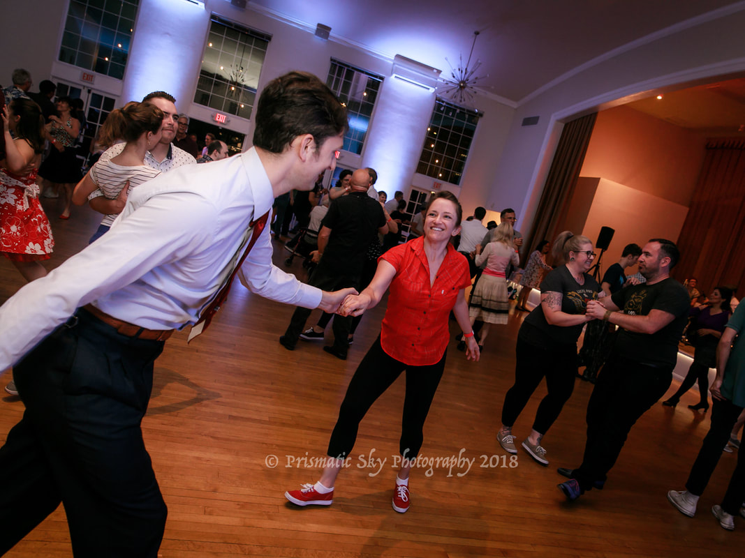 Vibrant dance event at Champion Ballroom, showcasing community and energy.