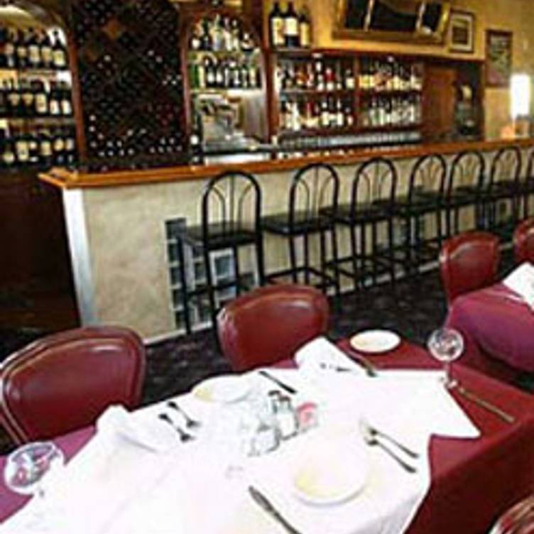 Dining room at Jack & Giulio's with elegant tables for intimate dining and networking events.