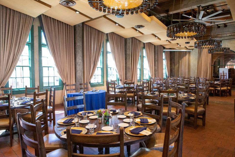 Elegant indoor banquet hall with navy accents, perfect for events and gatherings.
