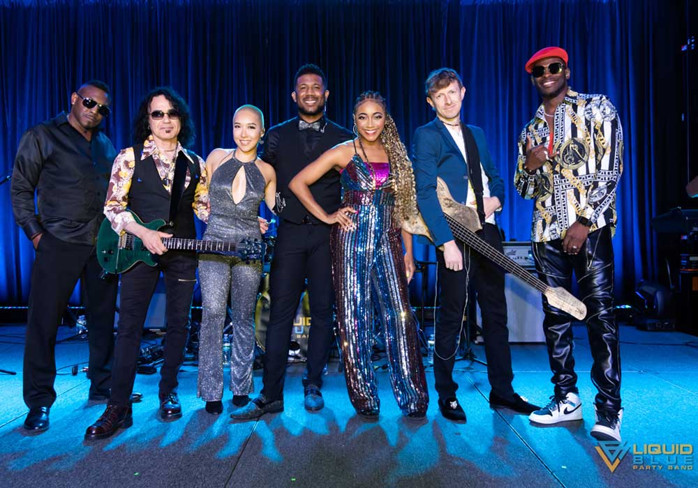 Dynamic party band in vibrant attire energizing events for memorable experiences.