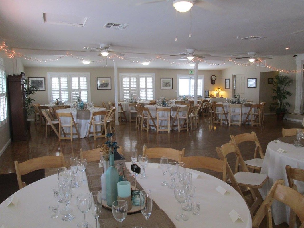 MBWC Clubhouse event space with round tables, ideal for weddings and corporate events.
