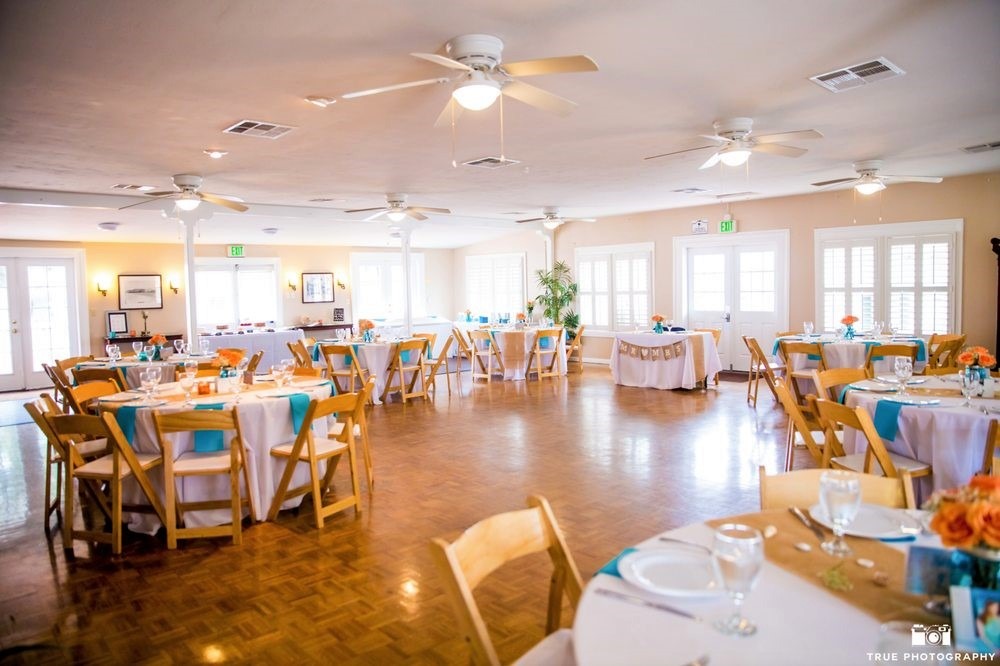 Bayside garden patio with round tables, ideal for weddings and corporate events.