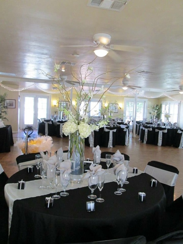 Bayside garden patio with elegant black and white decor for weddings and events.