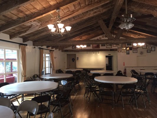 Auditorium at Sweetwater Woman's Club with rustic charm, perfect for events and gatherings.